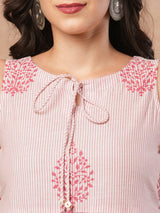 Woven striped and screen printed tiered dress with tie-up on neck with tassels.