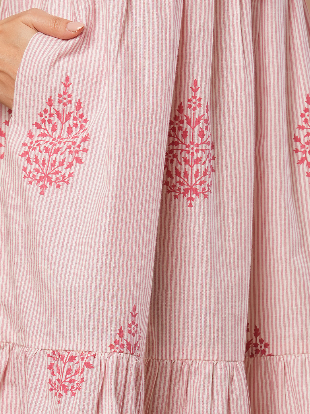 Woven striped and screen printed tiered dress with tie-up on neck with tassels.