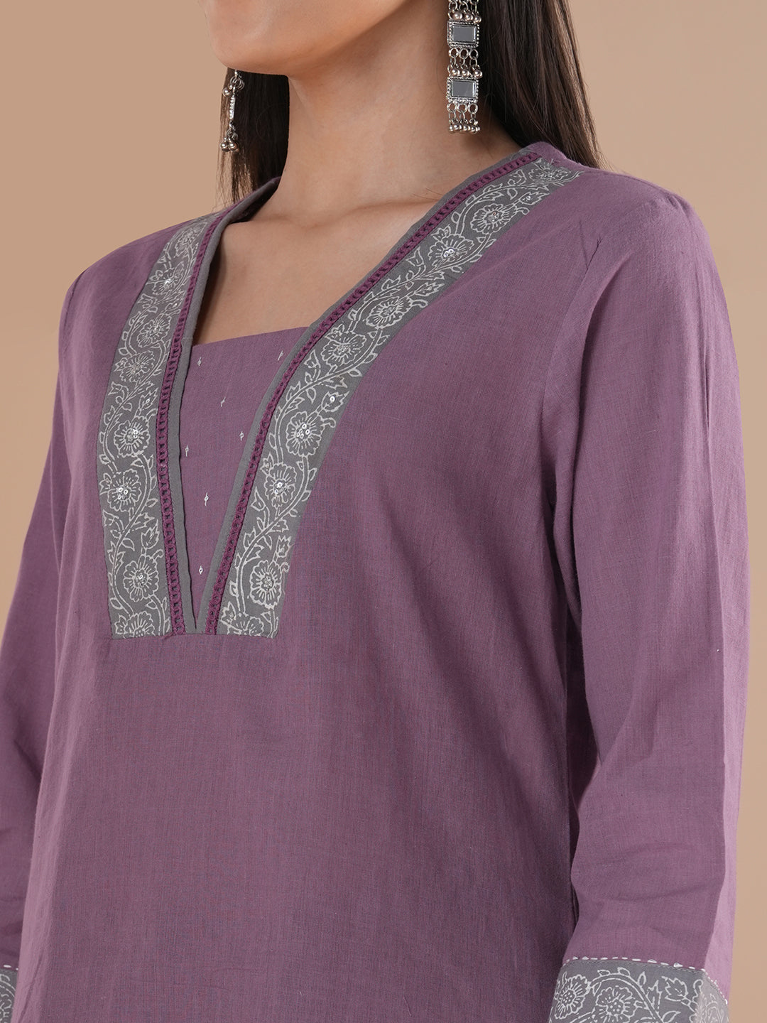 A 3-piece block printed kurta suit set with lace detail and block printed Dupatta