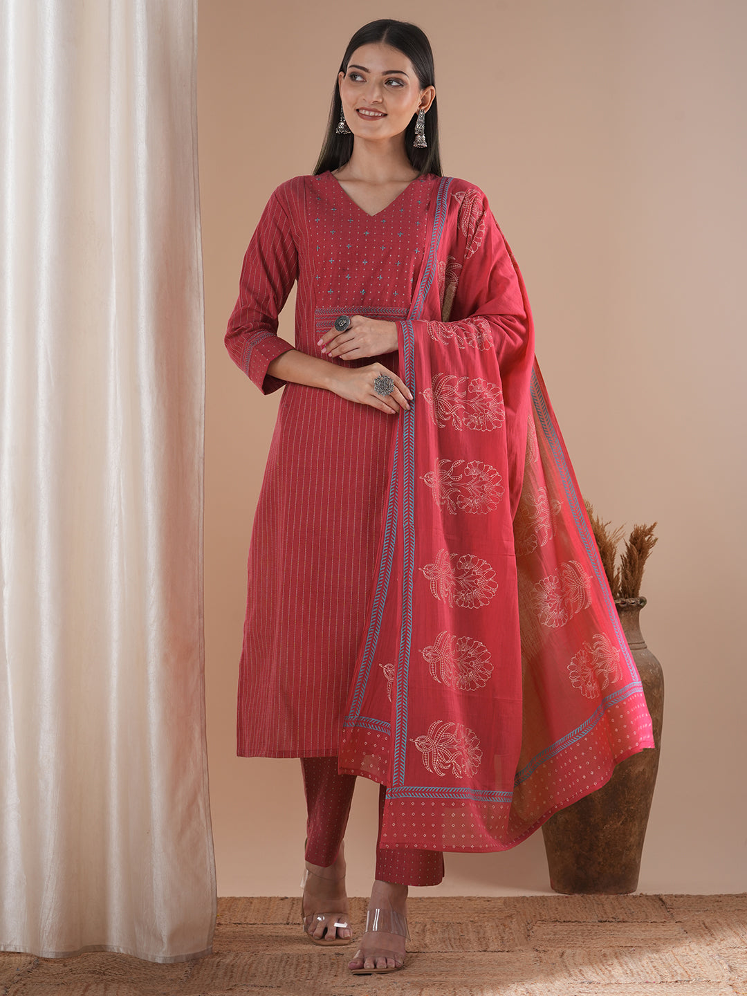 Pink dobby kurta set featuring highlights of contrasting colour embroidery & self bottom