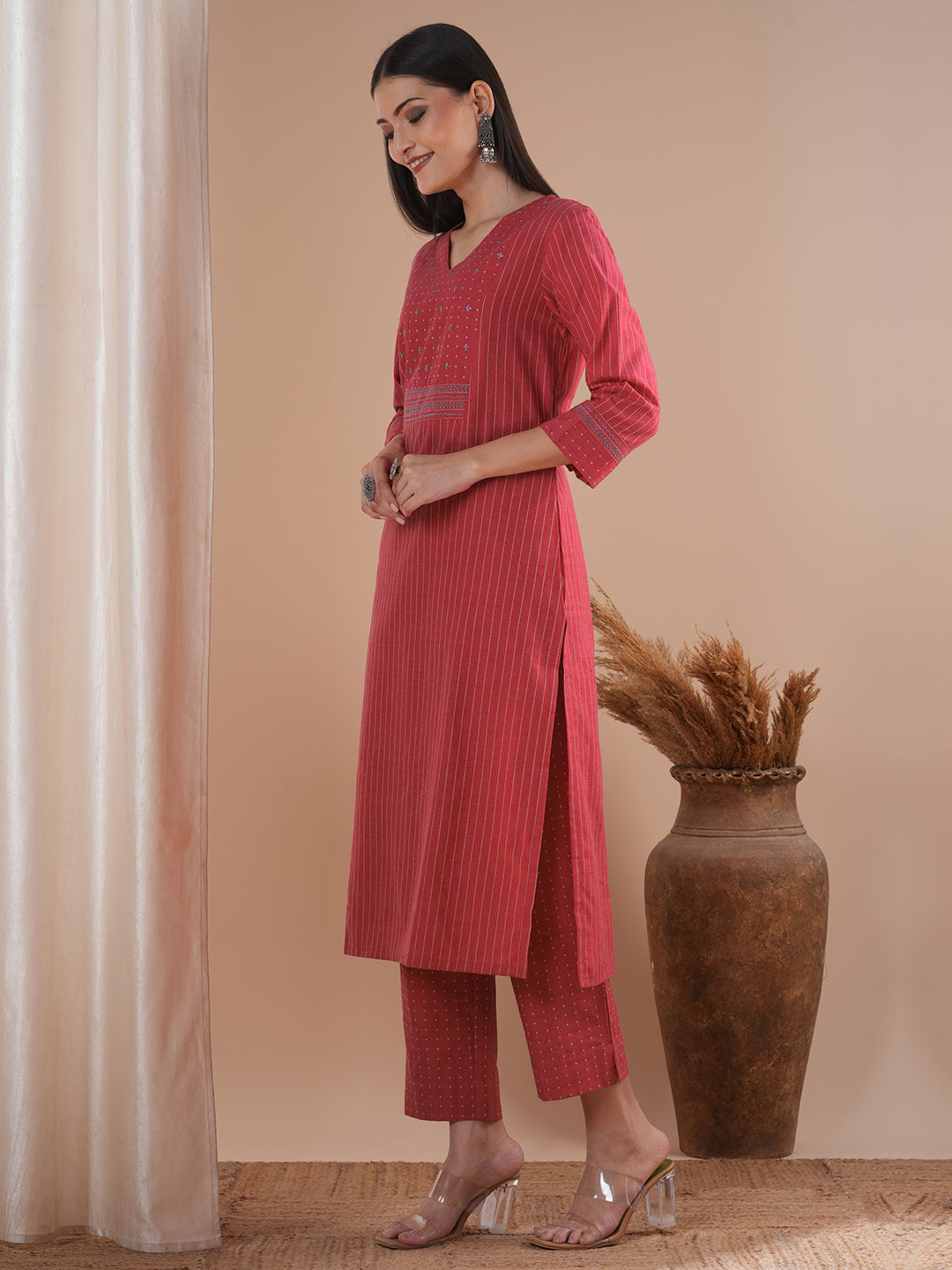 Pink dobby kurta set featuring highlights of contrasting colour embroidery & self bottom