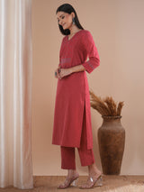 Pink dobby kurta set featuring highlights of contrasting colour embroidery & self bottom