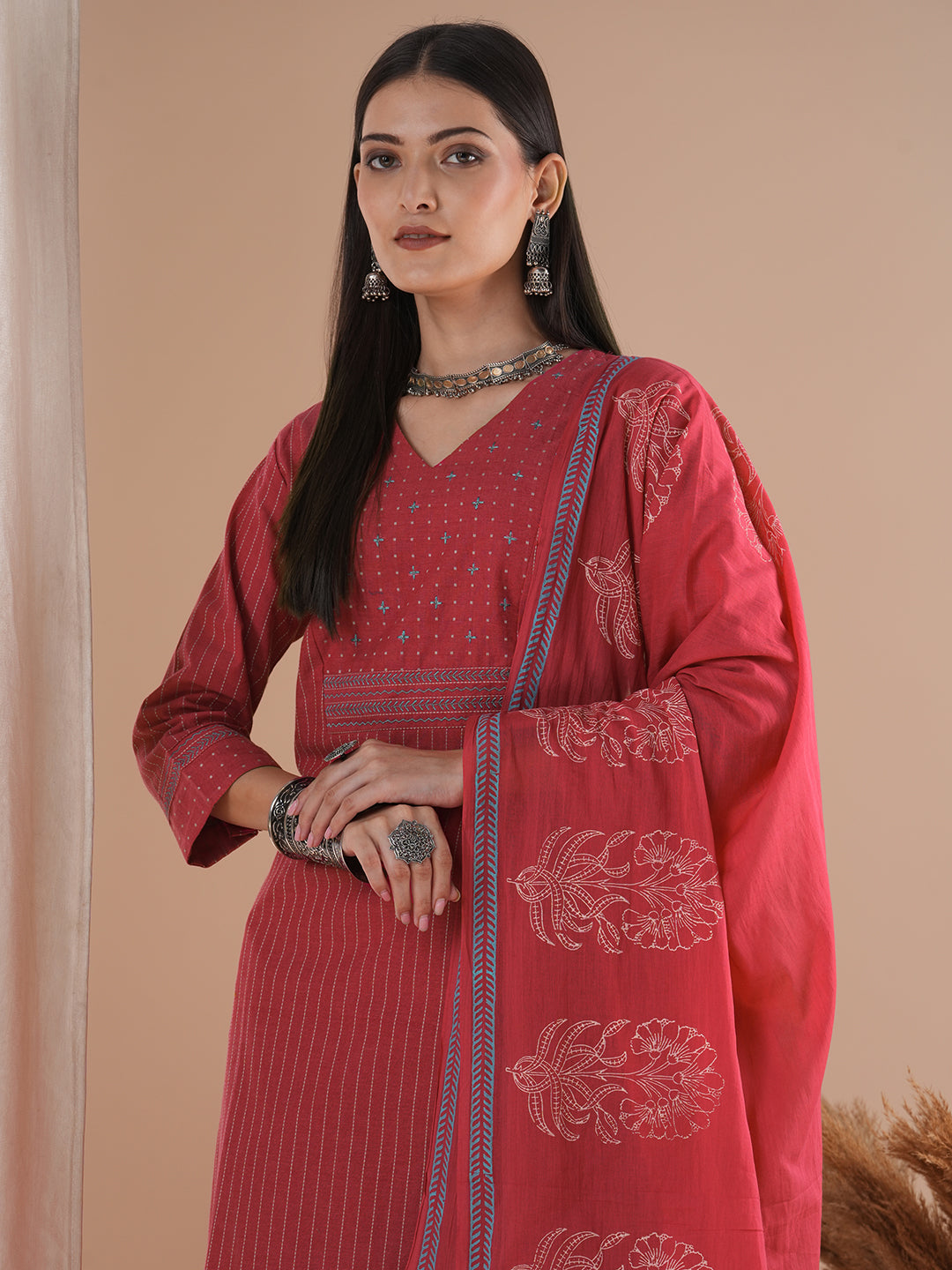 Pink dobby kurta set featuring highlights of contrasting colour embroidery & self bottom