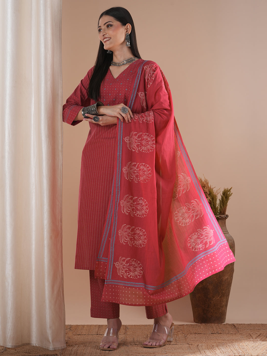 Pink dobby kurta set featuring highlights of contrasting colour embroidery & self bottom