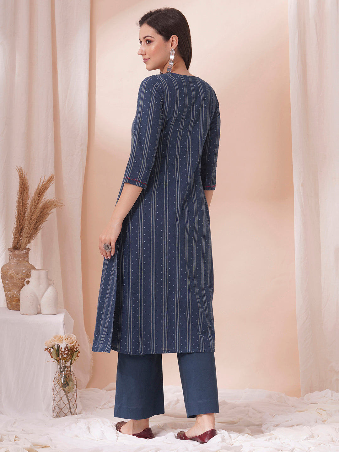 Box pleated dobby kurta in A-Line fit with hand embroidery and pocket.