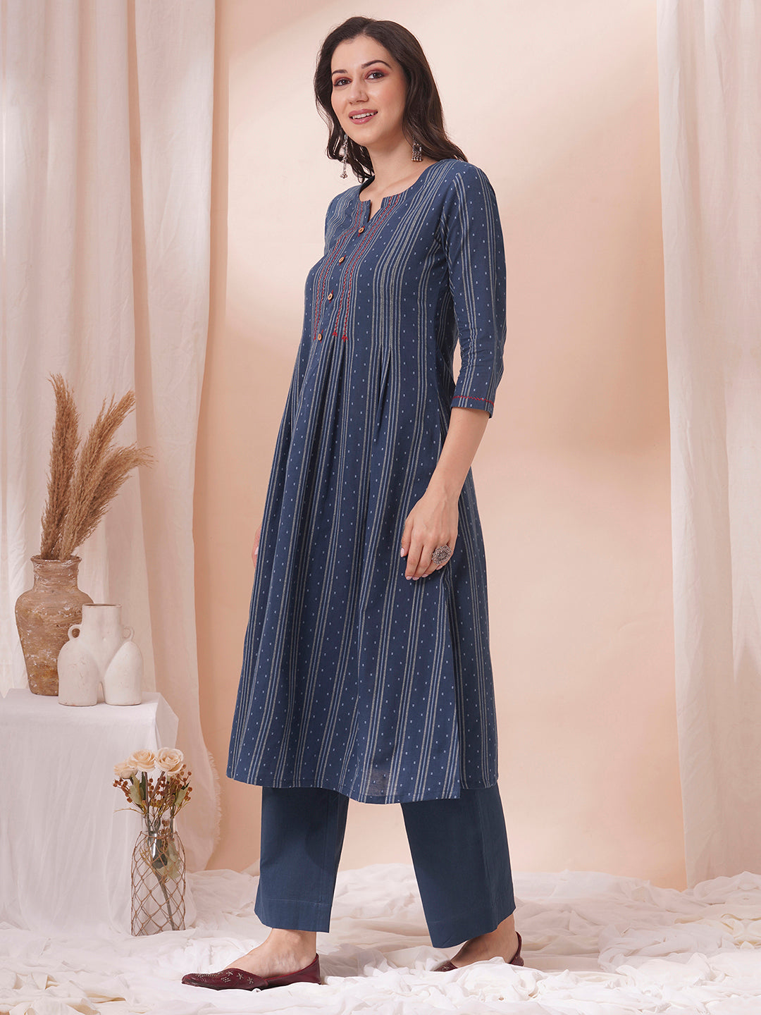 Box pleated dobby kurta in A-Line fit with hand embroidery and pocket.