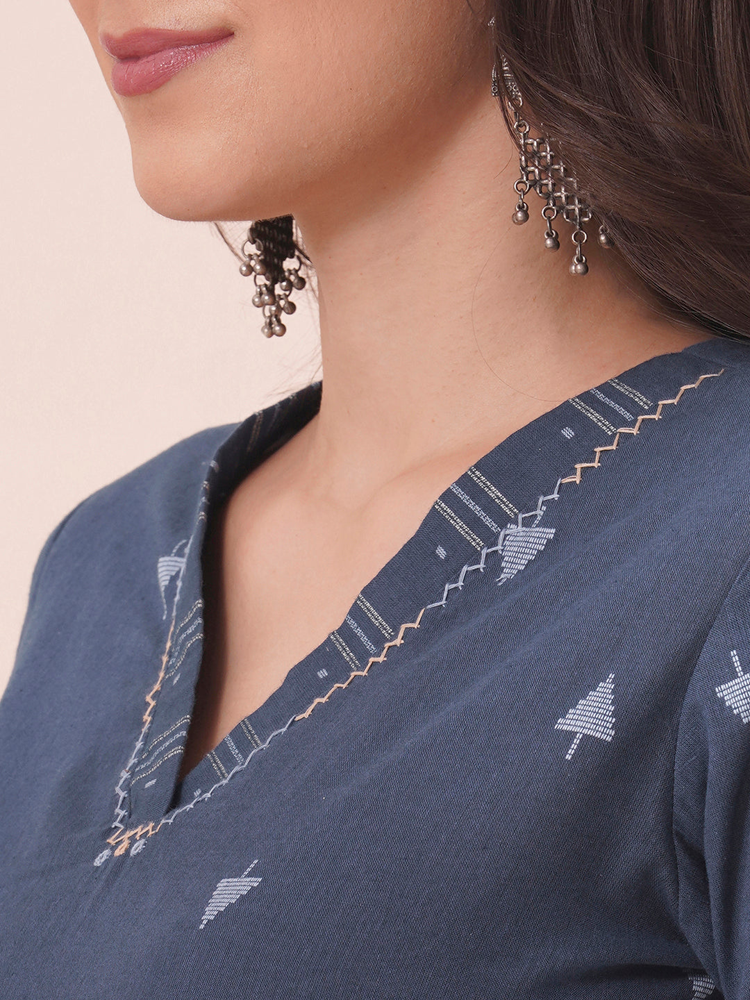 Straight fit cotton dobby kurta with hand embroidery.