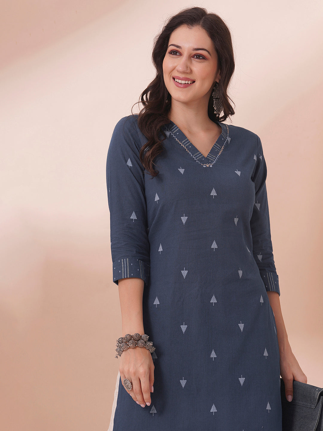 Straight fit cotton dobby kurta with hand embroidery.
