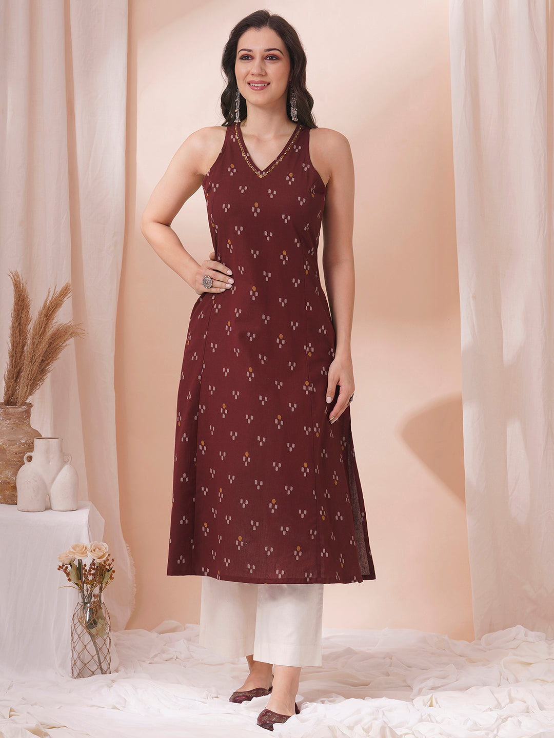 A-Line V-neck kurta in printed cotton flex with hand embroidery.