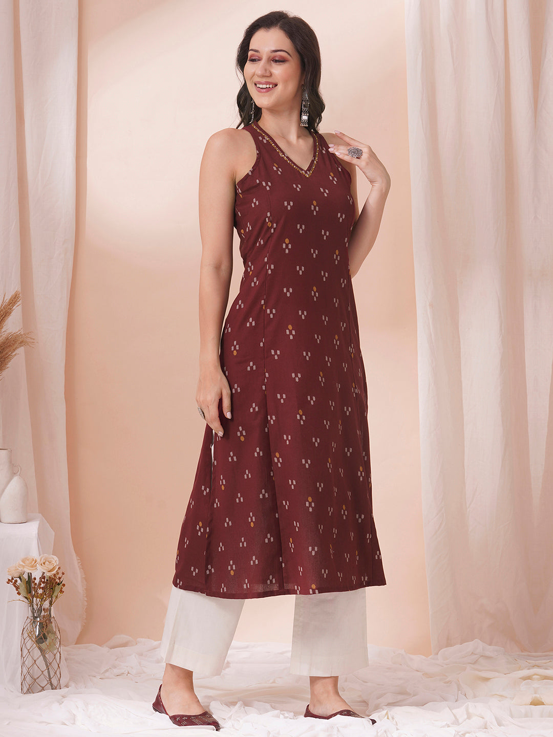 A-Line V-neck kurta in printed cotton flex with hand embroidery.