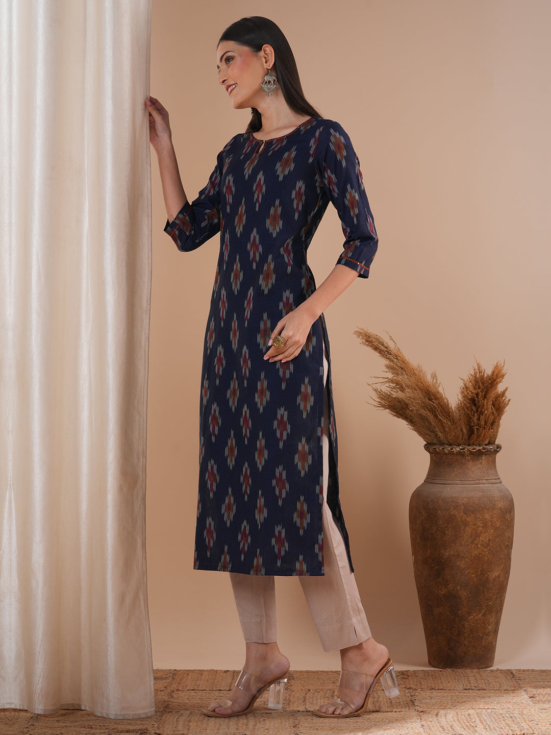 Straight fit cotton kurta in woven ikat fabric with hand embroidery