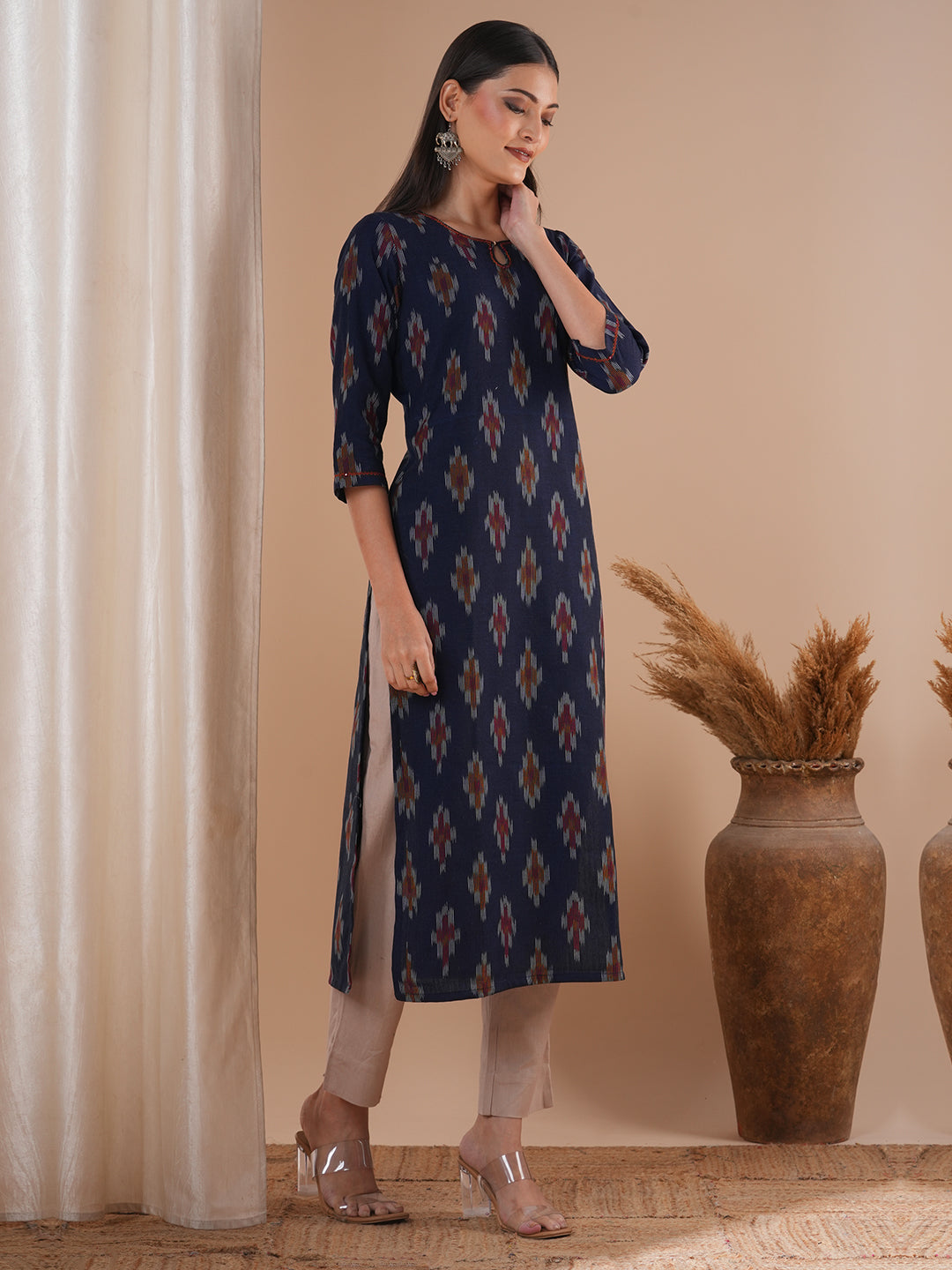 Straight fit cotton kurta in woven ikat fabric with hand embroidery