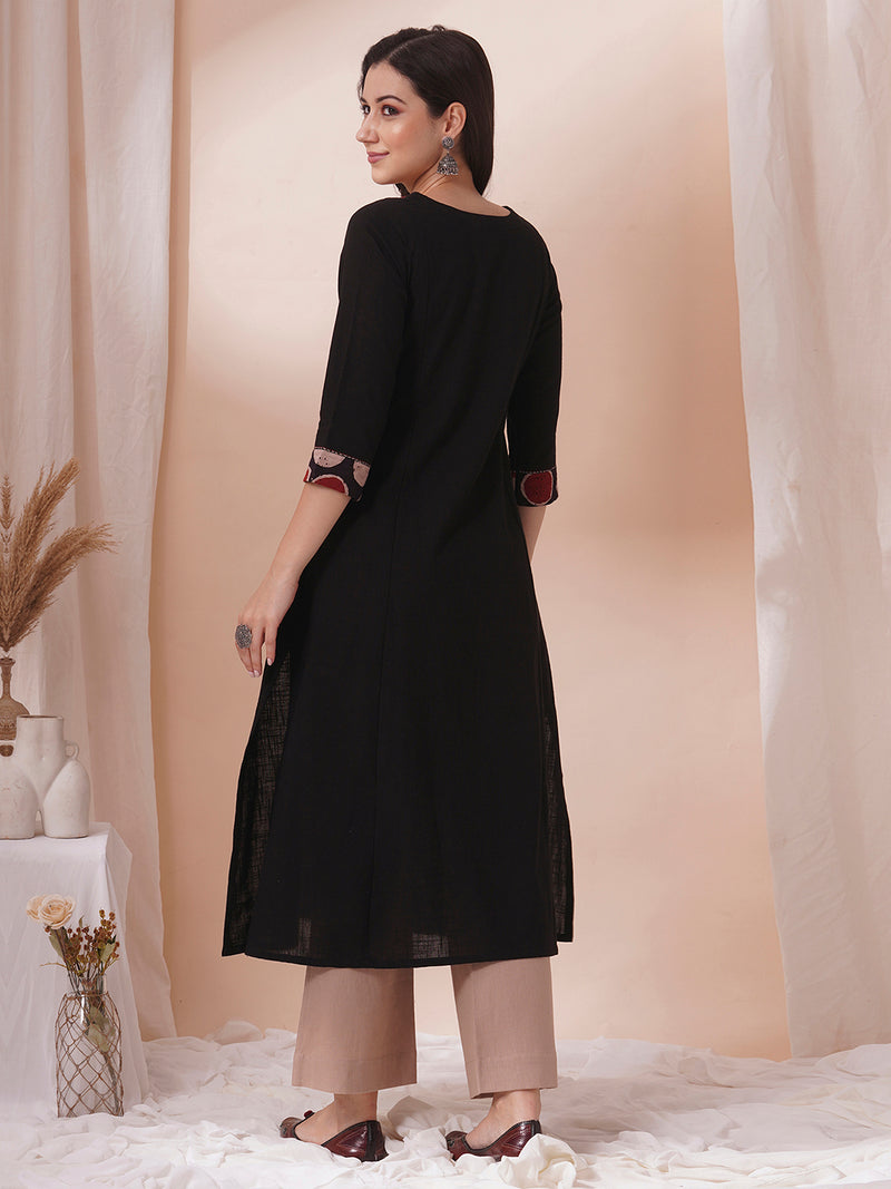 Princess line kurta in black cotton slub paired with hand block and hand embroidery.