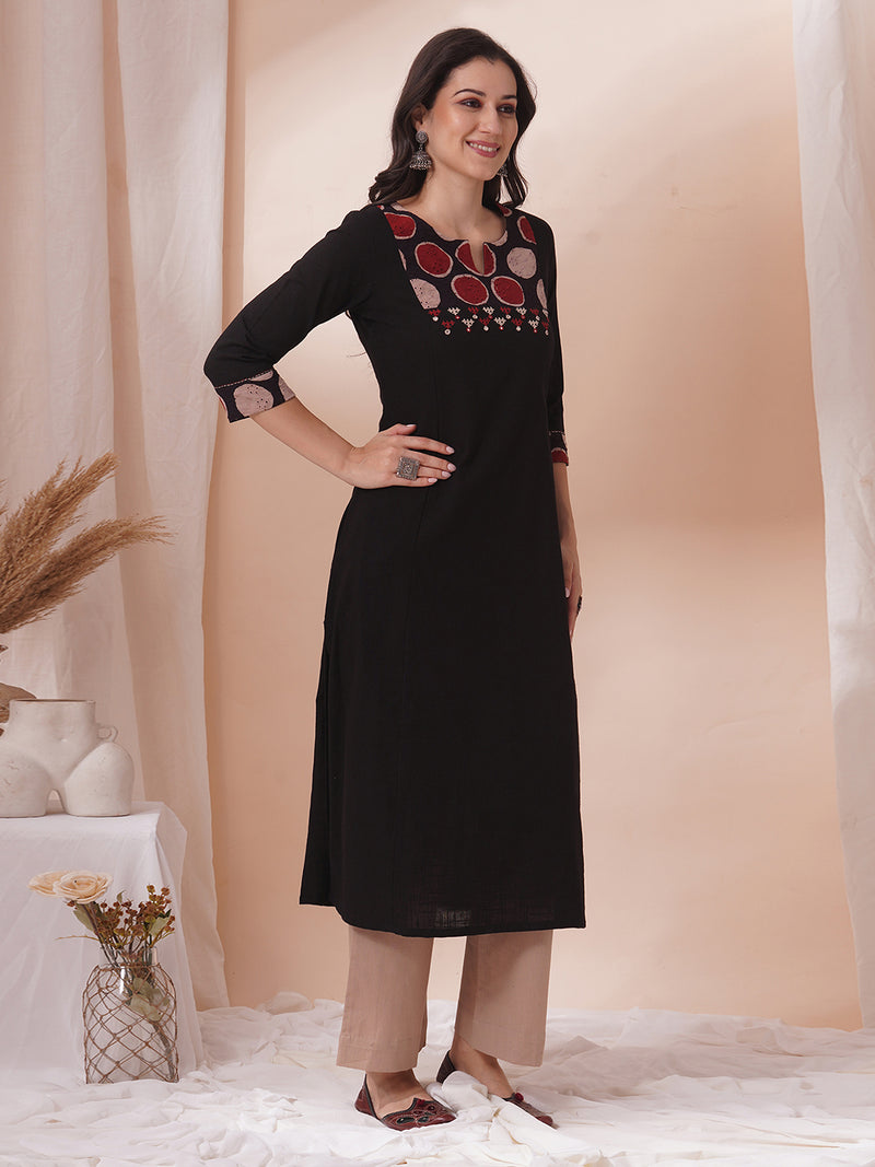 Princess line kurta in black cotton slub paired with hand block and hand embroidery.