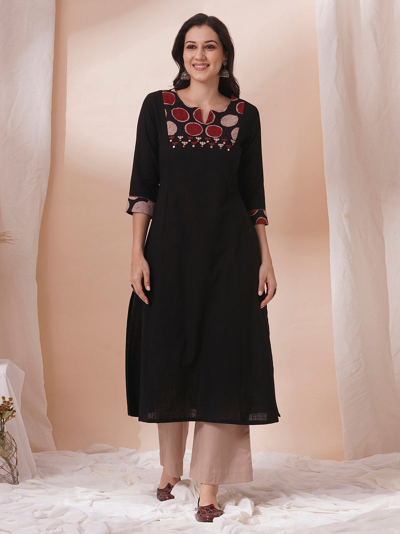 Princess line kurta in black cotton slub paired with hand block and hand embroidery.