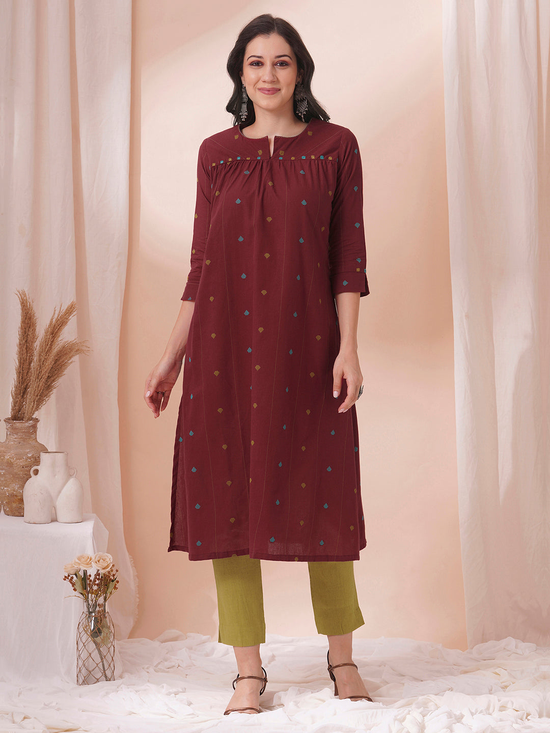 Pocketed cotton dobby kurta with gathering and mirror work.