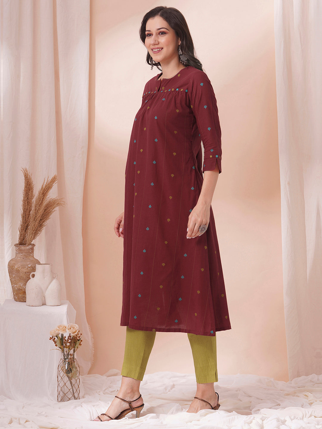 Pocketed cotton dobby kurta with gathering and mirror work.