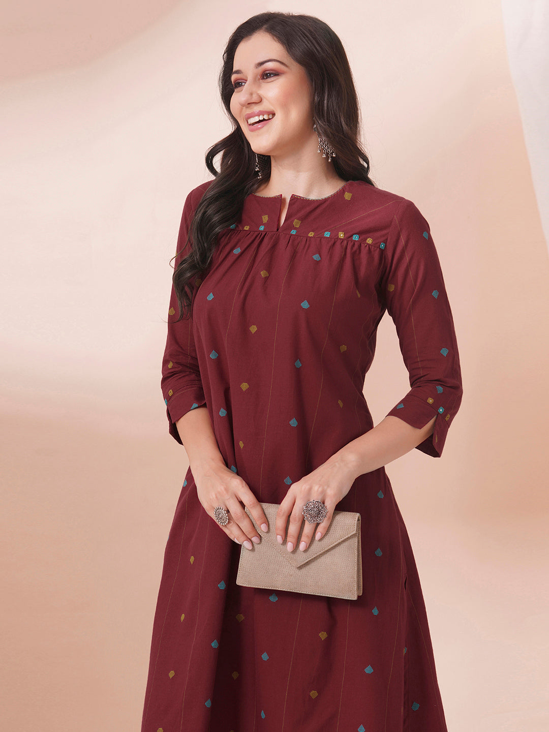 Pocketed cotton dobby kurta with gathering and mirror work.