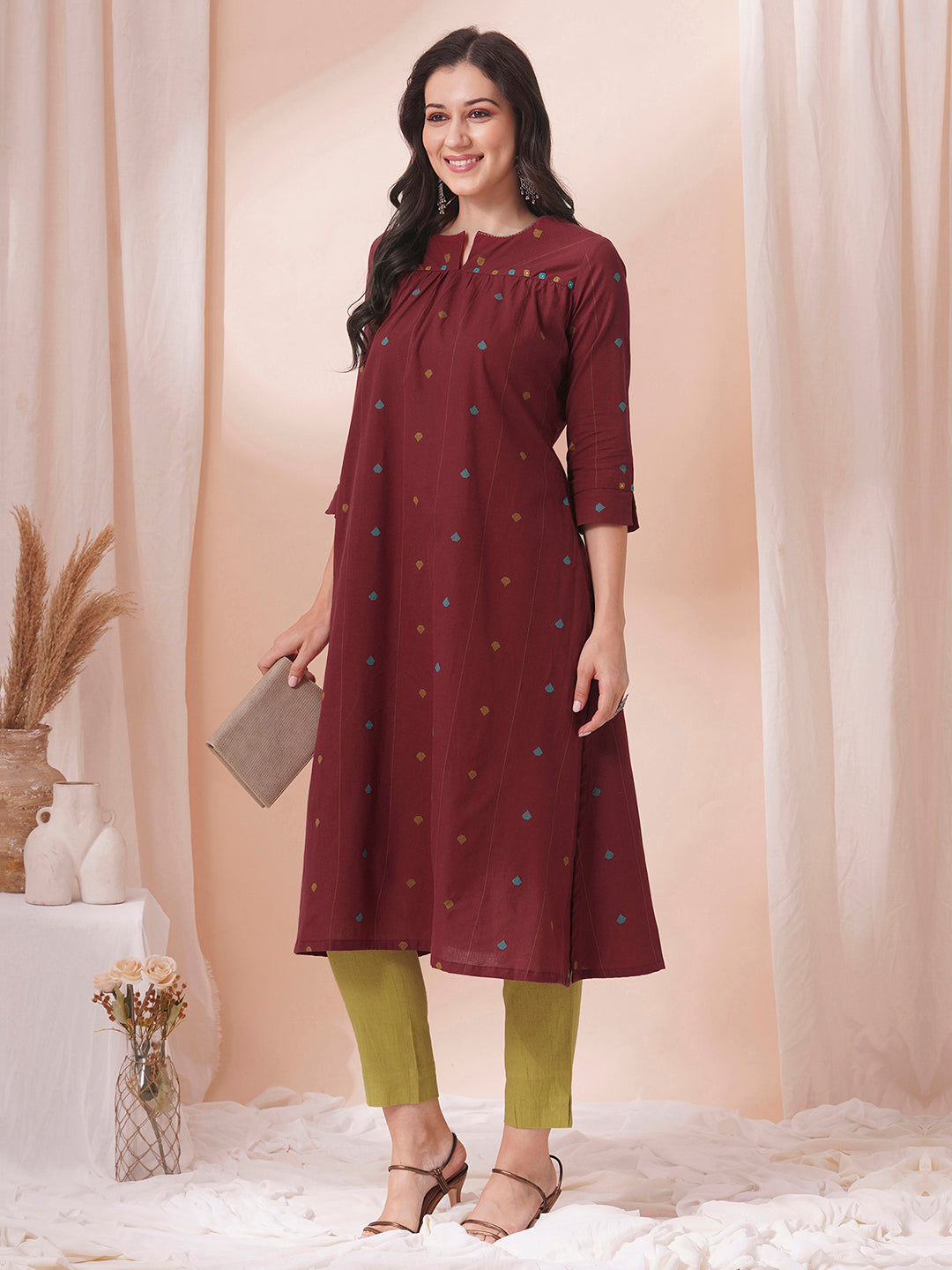 Pocketed cotton dobby kurta with gathering and mirror work.