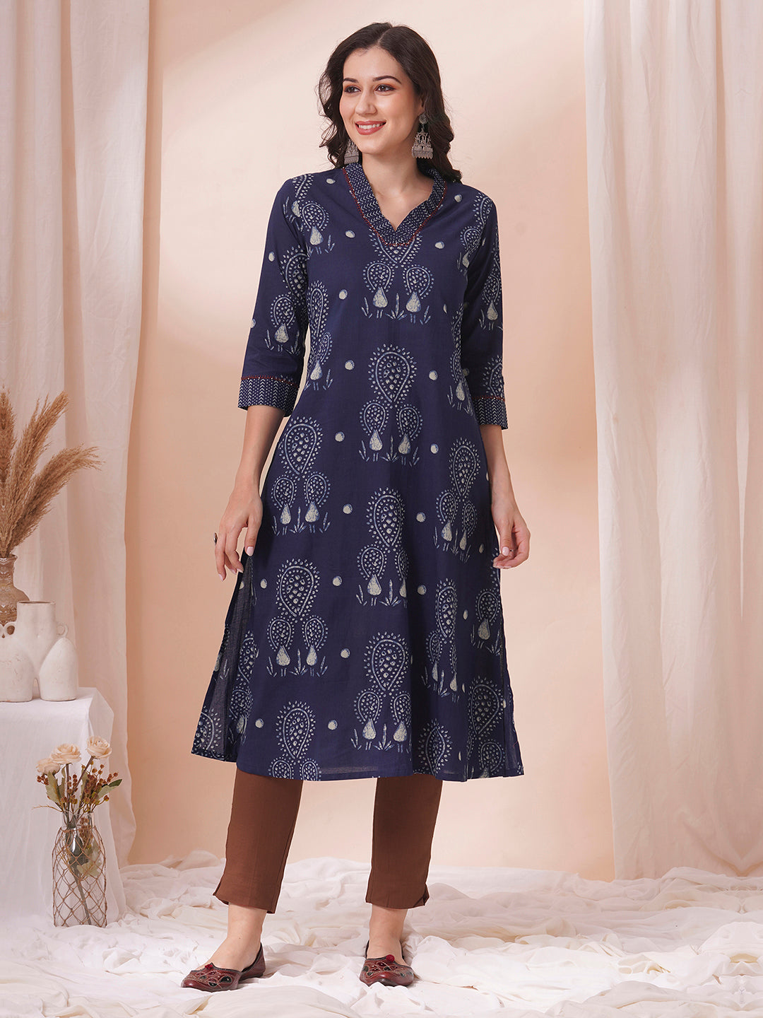 A-line kurta in printed cotton with gathered stripe print on the neckline with handwork.