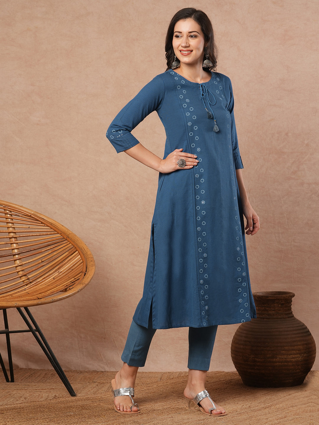 A-line cotton flex kurta with mirror work and attached thread tassels.