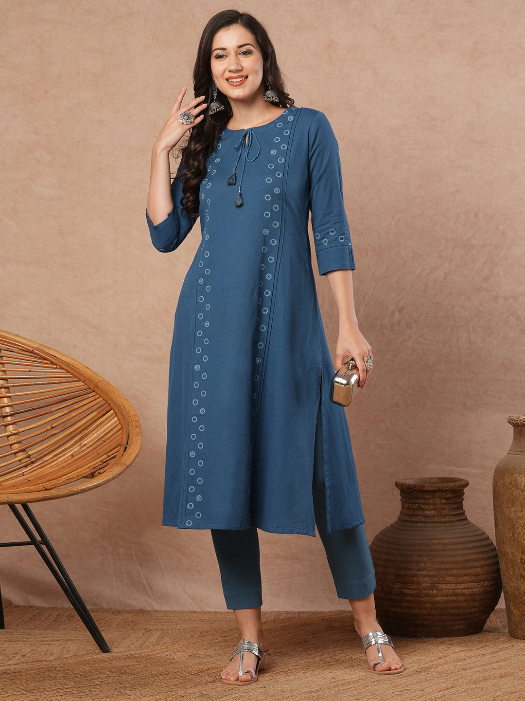 A-line cotton flex kurta with mirror work and attached thread tassels.