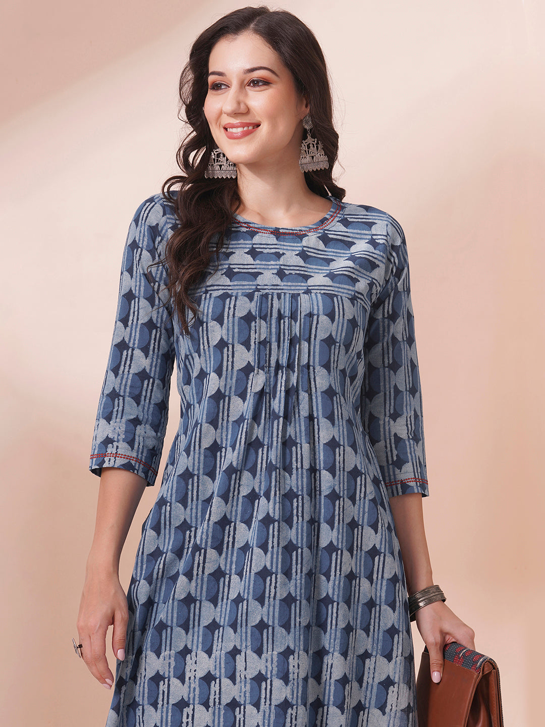 Straight fit dhabu print kurta with embroidery and pleating.