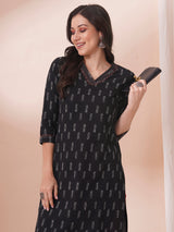 Straight fit cotton kurta in woven ikkat fabric with stitch lines and hand embroidery.