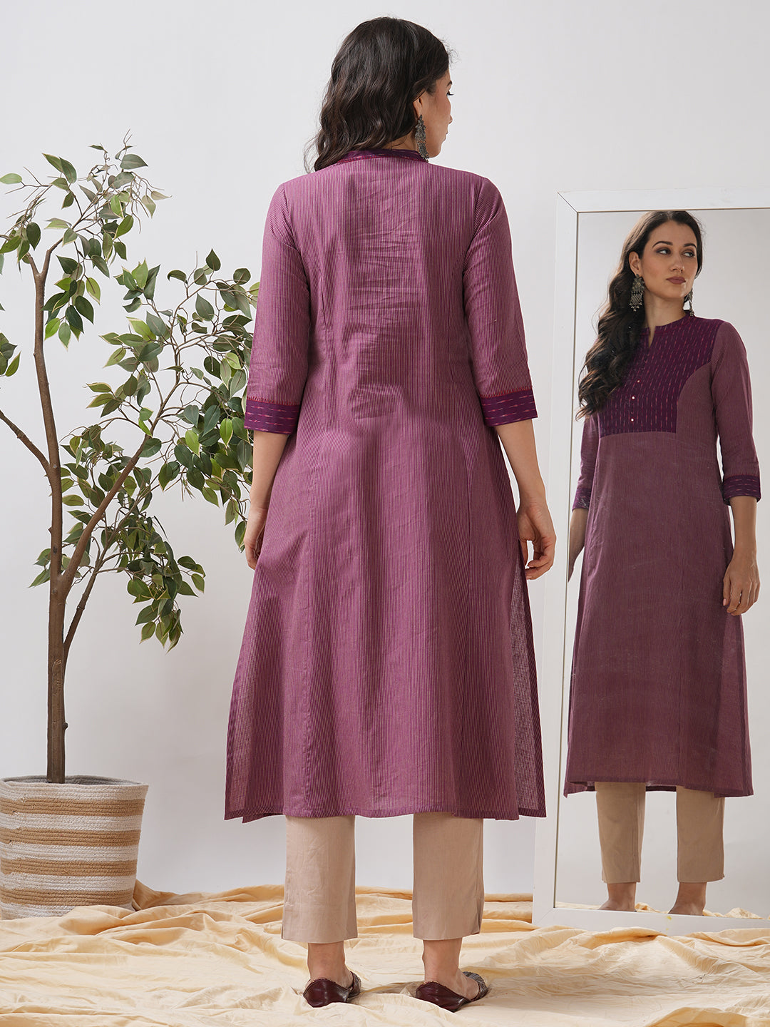 Striped cotton kurta in an A line fit with an ikkat trim and hand embroidery.
