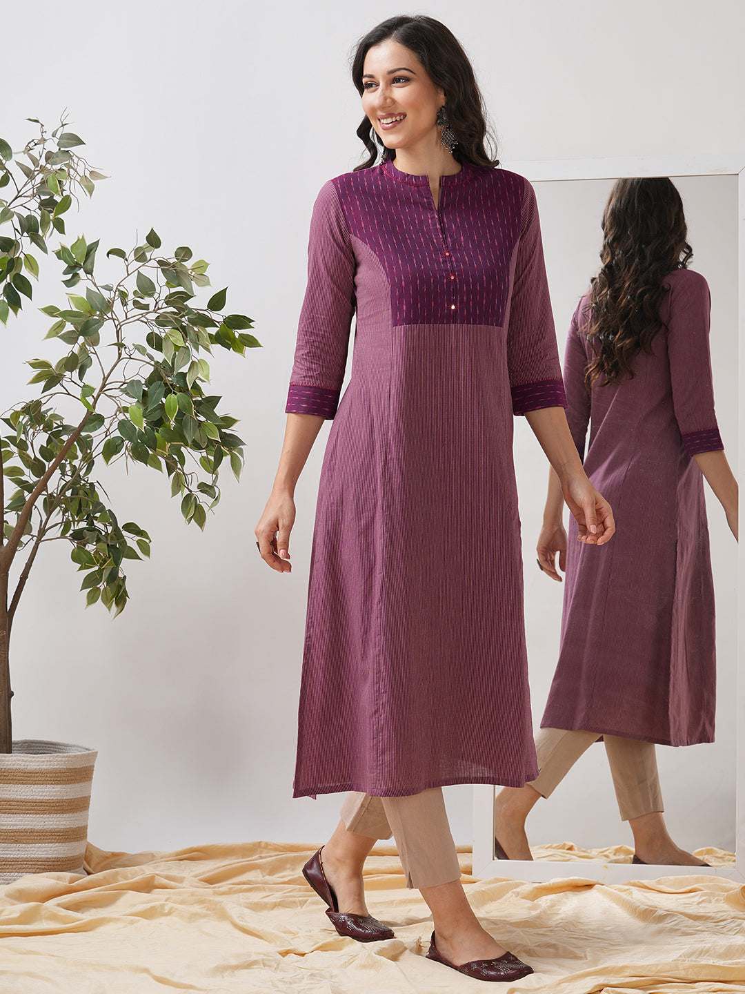 Striped cotton kurta in an A line fit with an ikkat trim and hand embroidery.