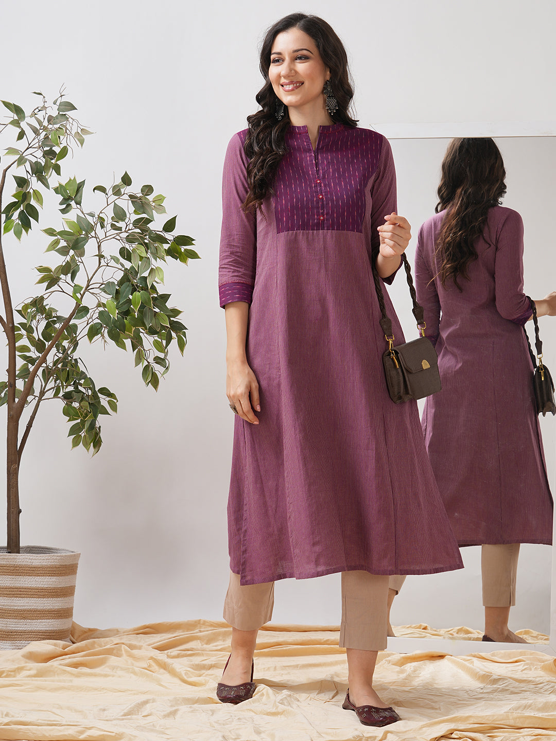Striped cotton kurta in an A line fit with an ikkat trim and hand embroidery.