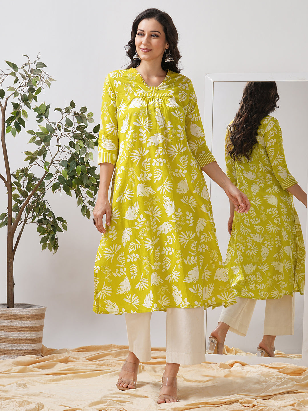 Gathered A line kurta in printed cotton fabric with hand embroidery and pocket.