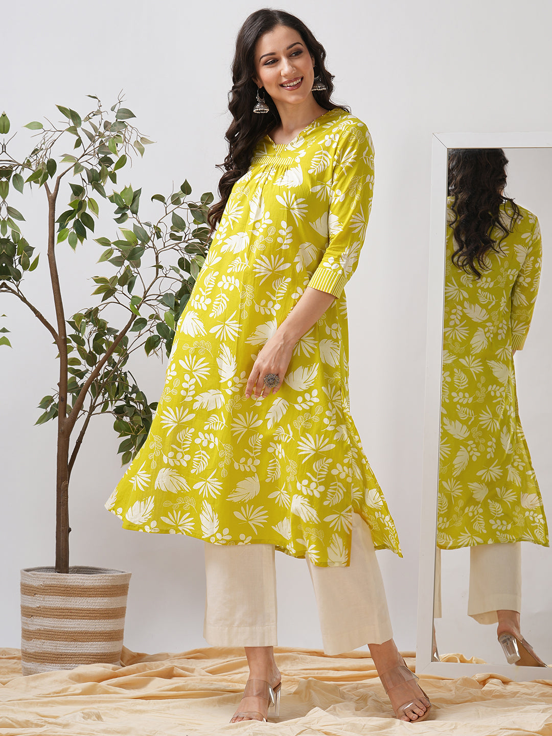 Gathered A line kurta in printed cotton fabric with hand embroidery and pocket.