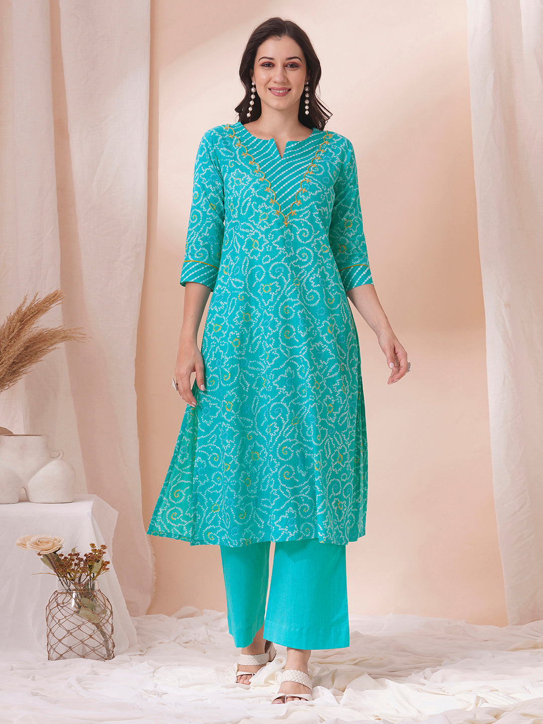 A-line bandhani print kurta with embroidery and cutwork detailing on the a zone and sleeve.