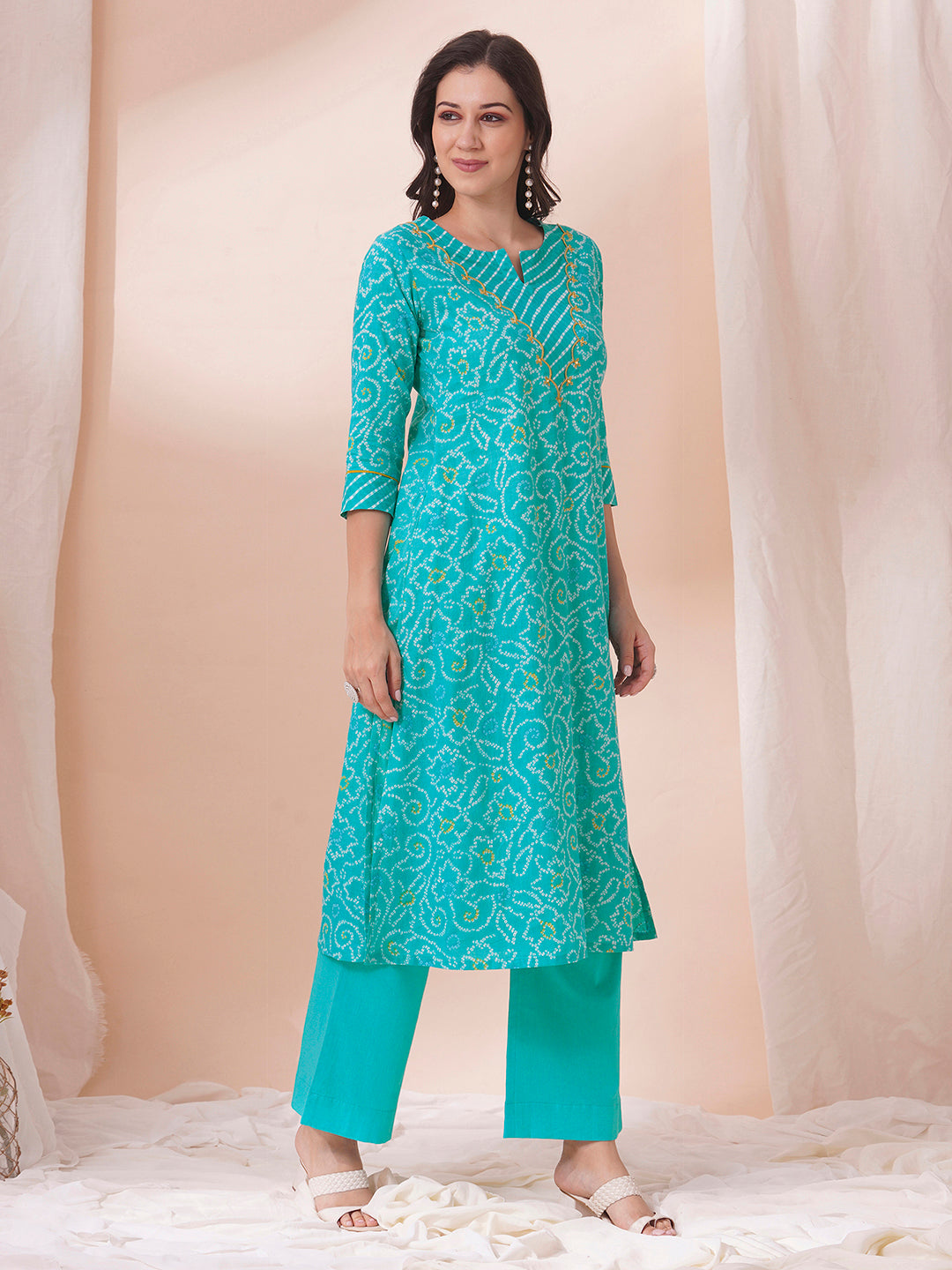 A-line bandhani print kurta with embroidery and cutwork detailing on the a zone and sleeve.