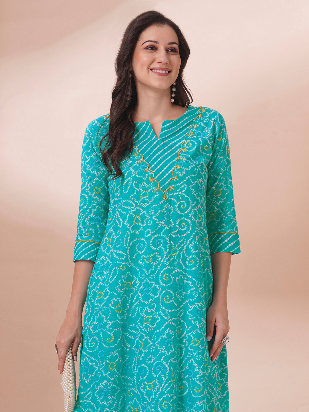 A-line bandhani print kurta with embroidery and cutwork detailing on the a zone and sleeve.