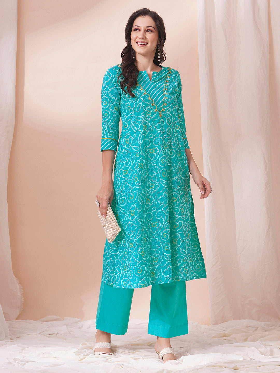 A-line bandhani print kurta with embroidery and cutwork detailing on the a zone and sleeve.