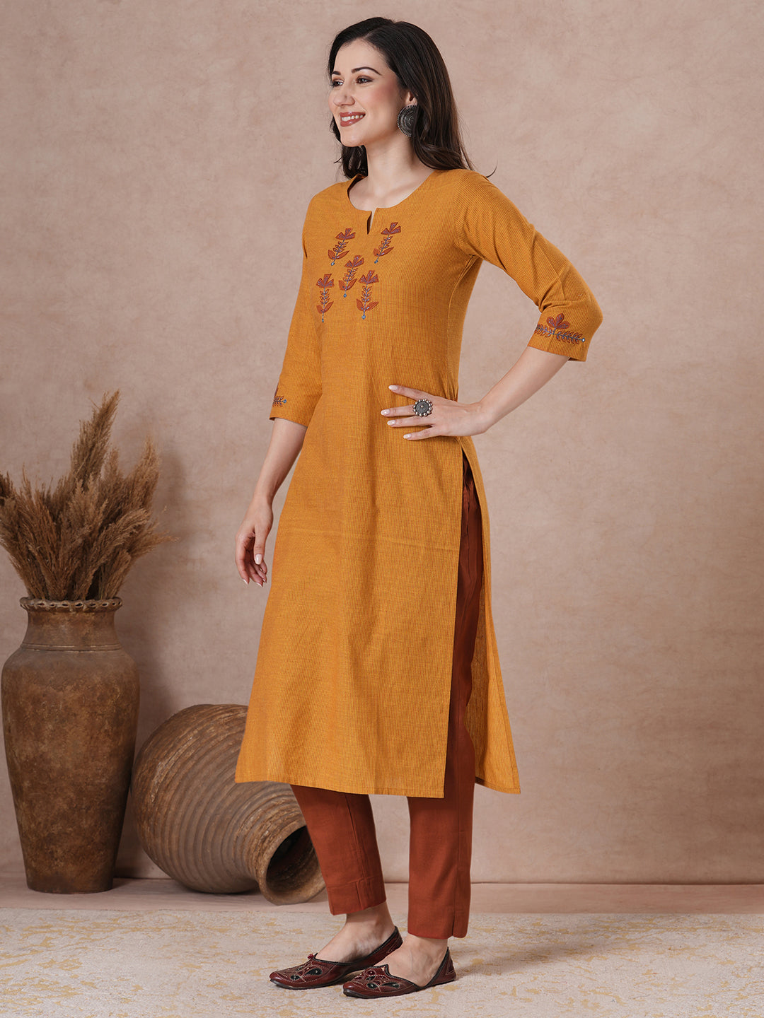 Embroidered straight fit kurta in checkered cotton fabric.
