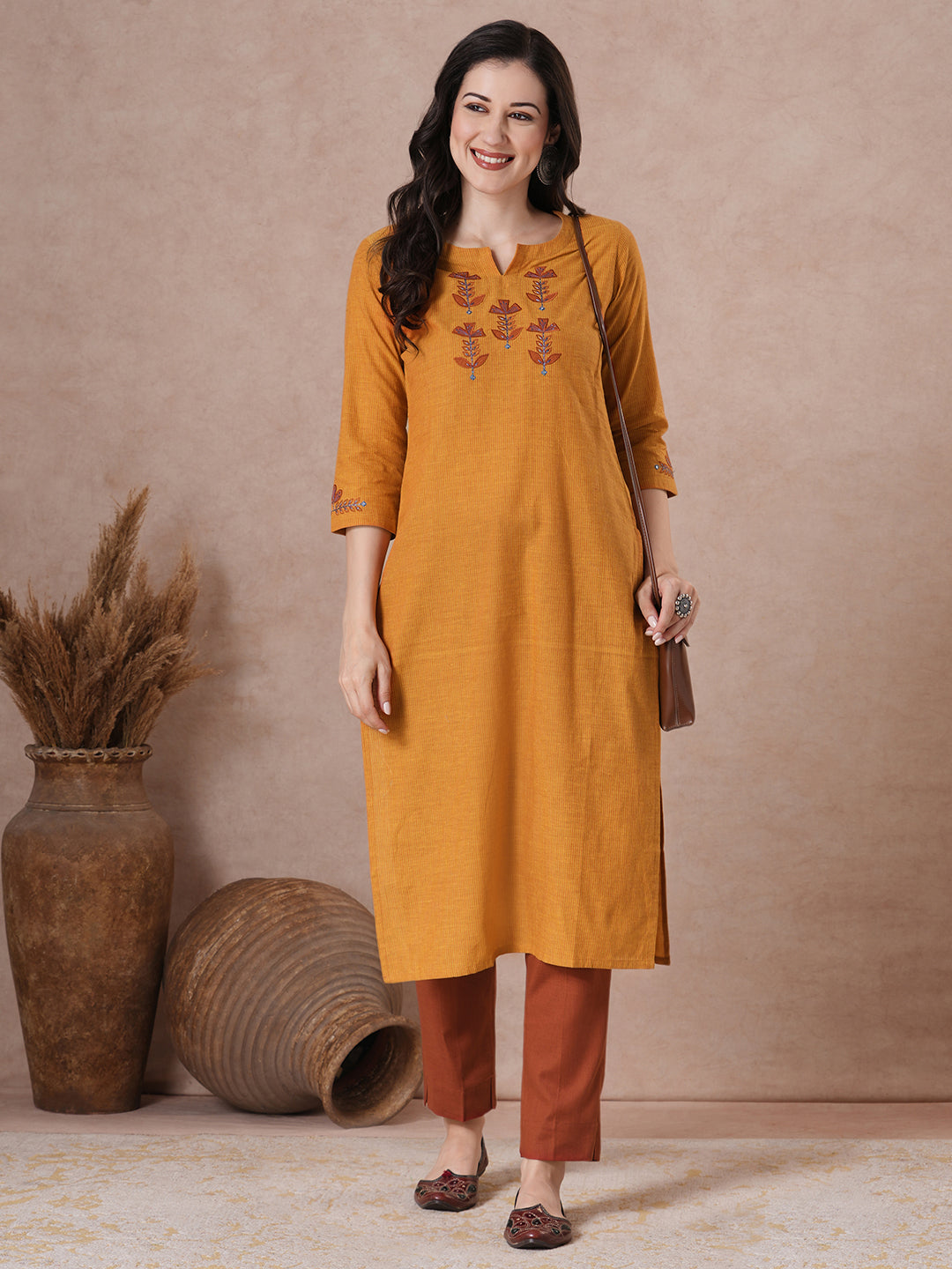 Embroidered straight fit kurta in checkered cotton fabric.