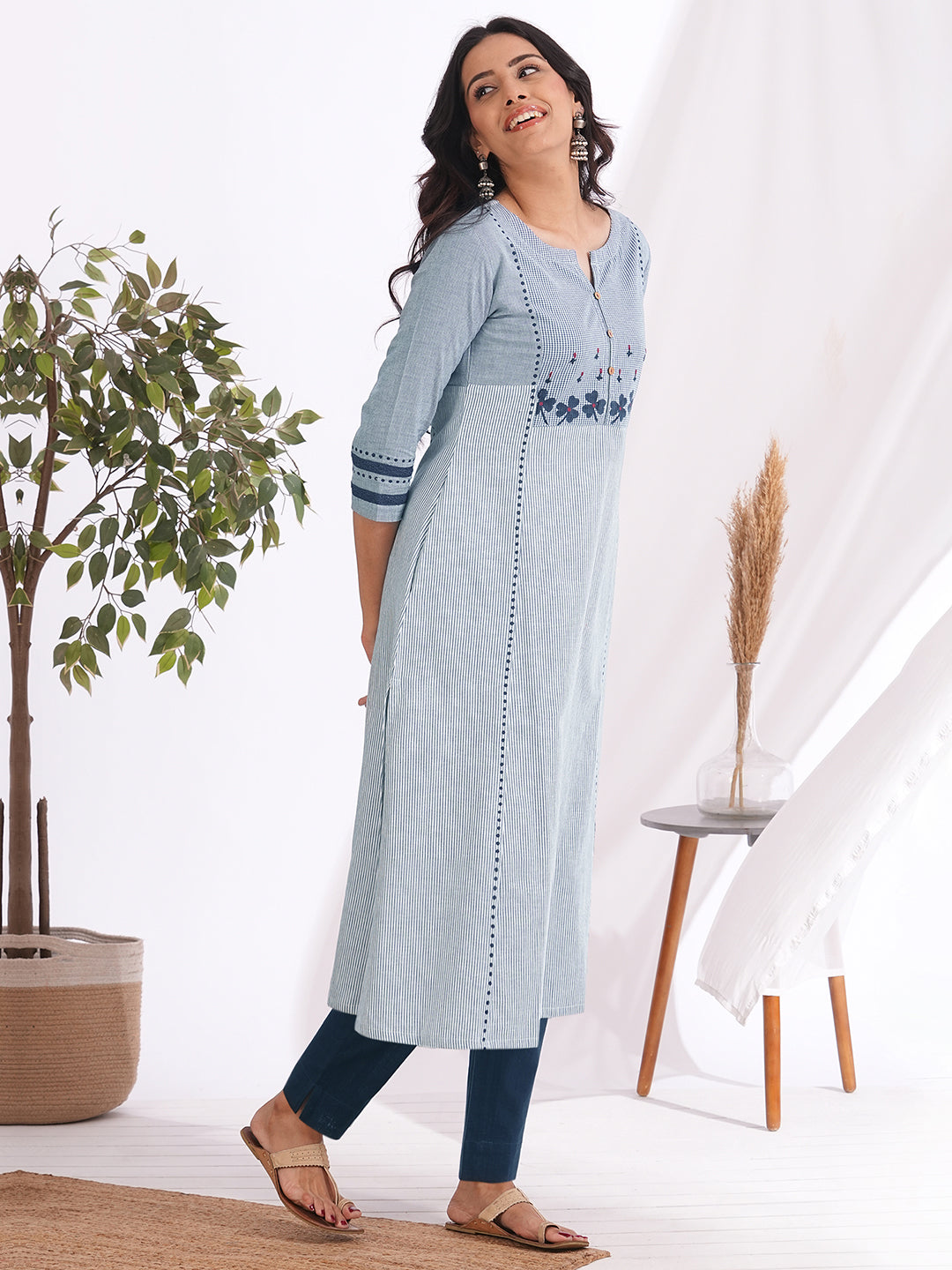 Pocketed A-line kurta in woven cotton fabric with block print and hand embroidery