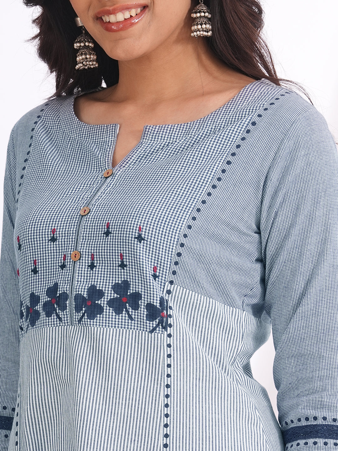 Pocketed A-line kurta in woven cotton fabric with block print and hand embroidery