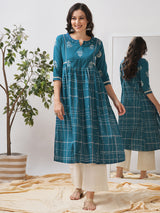 Pocketed A line kurta highlighted with lace, gathering and mirror work.