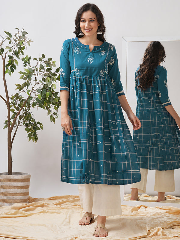 Pocketed A line kurta highlighted with lace, gathering and mirror work.