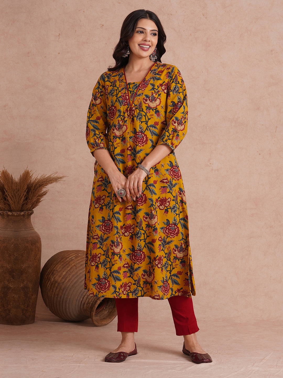 A-Line cotton print kurta with couching lines, sequin work, puffed sleeves and a pocket.