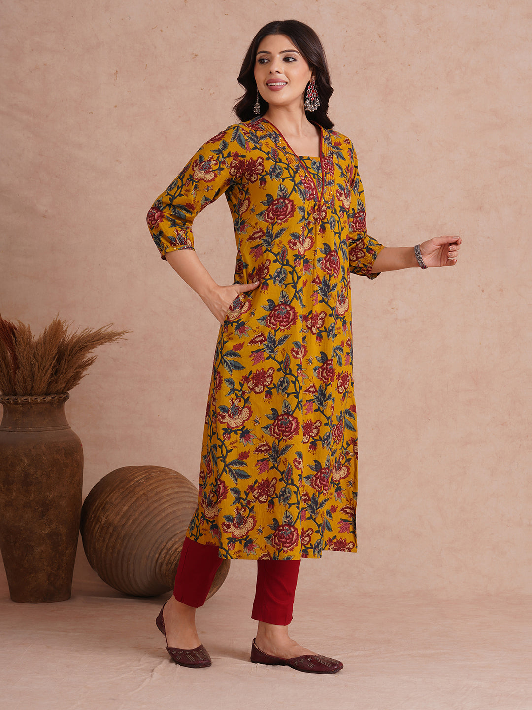A-Line cotton print kurta with couching lines, sequin work, puffed sleeves and a pocket.