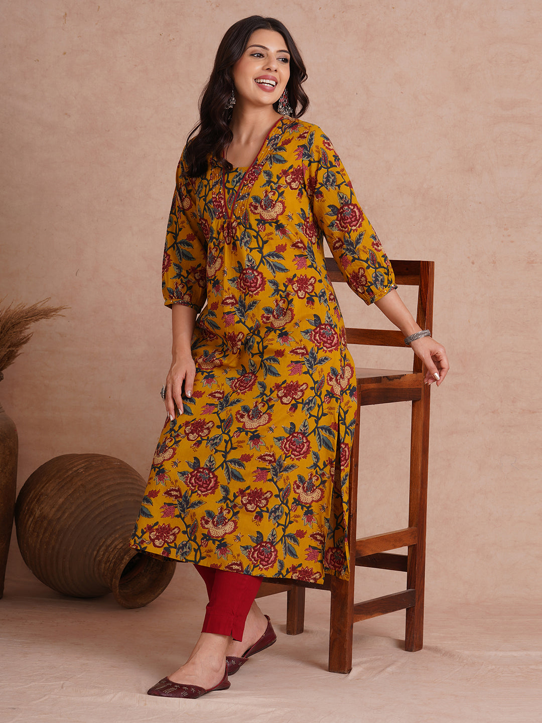 A-Line cotton print kurta with couching lines, sequin work, puffed sleeves and a pocket.