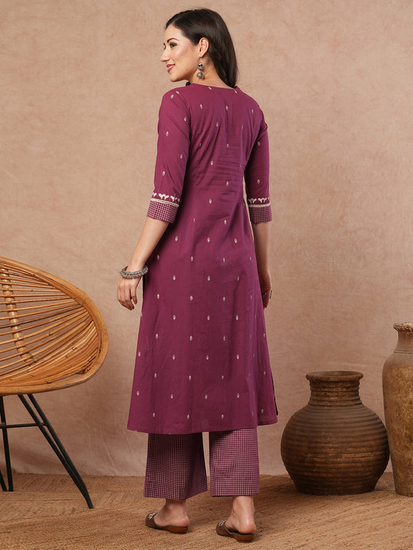 Pleated A-line printed cotton kurta with lace, block print, handwork and pocket.