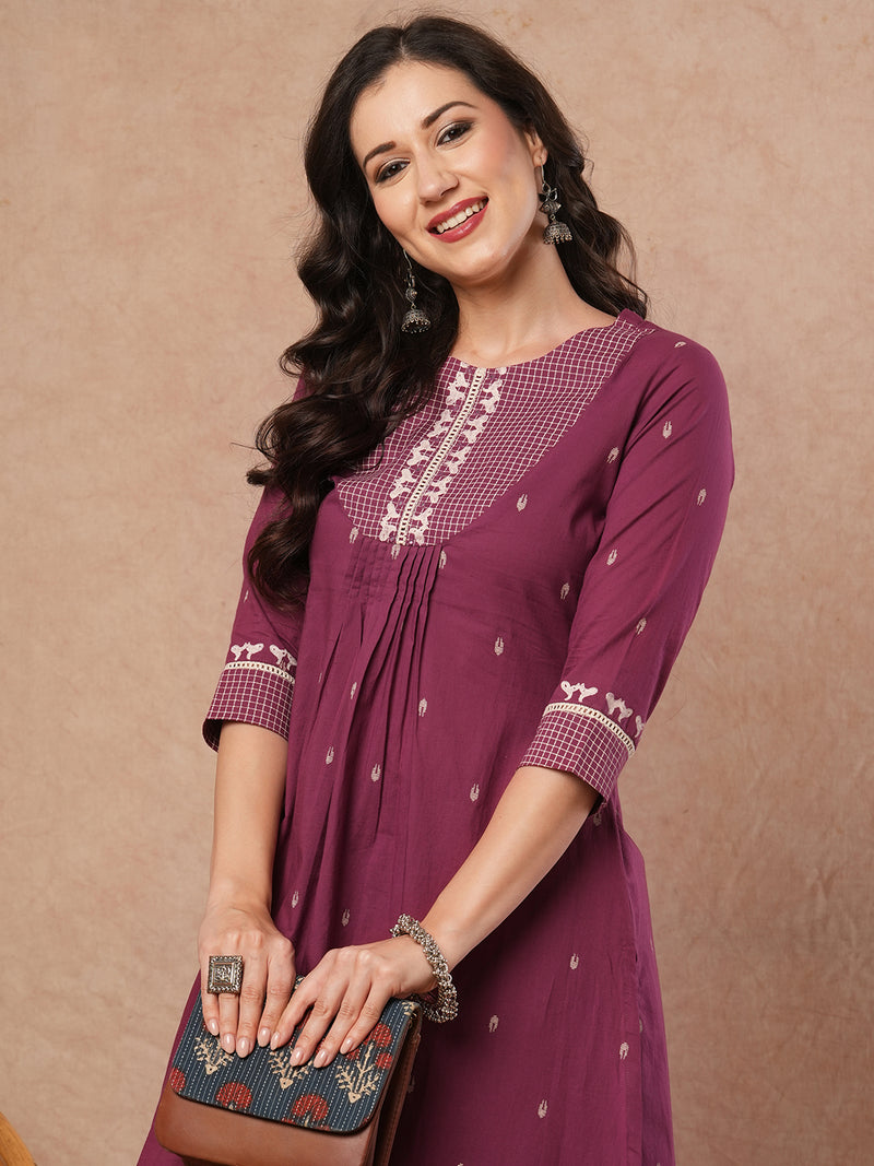 Pleated A-line printed cotton kurta with lace, block print, handwork and pocket.