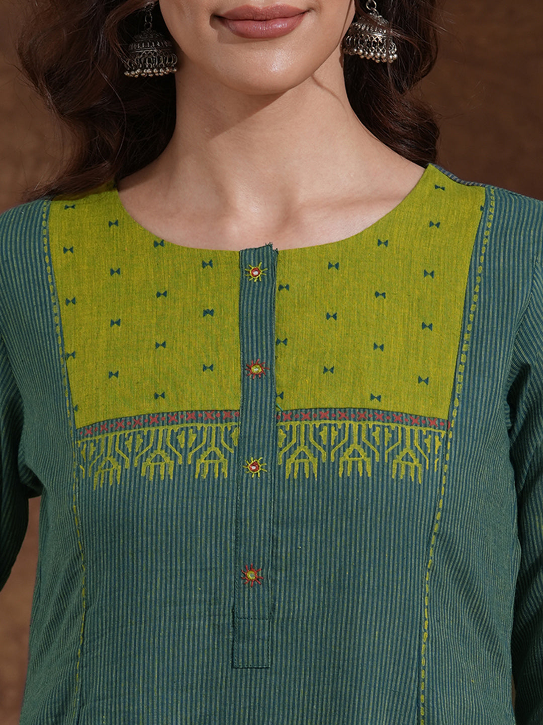 Pocketed A-line kurta in woven stripe cotton with a dobby trim and handwork detailing.