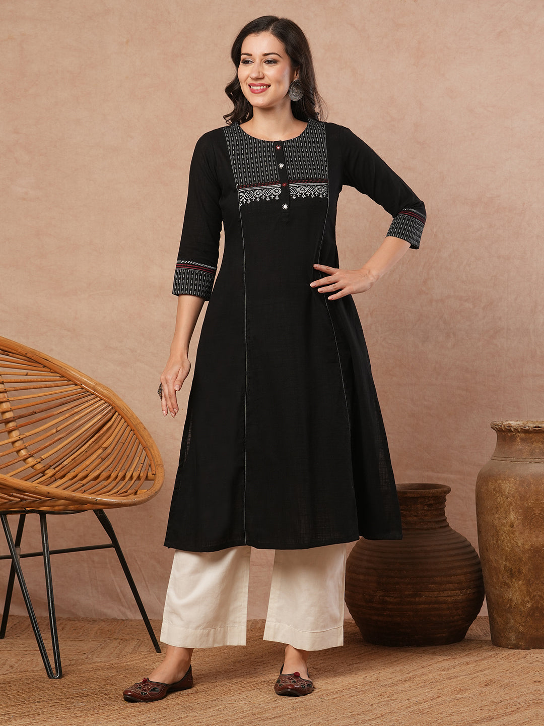 Pocketed A-line kurta in cotton slurb fabric with block print and handwork detailing.
